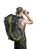 ISOLATED MAN WITH BACKPACK AND BINOCULAR