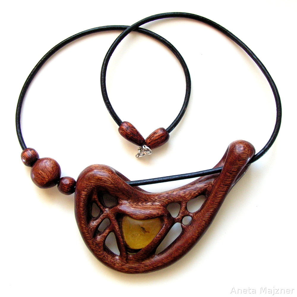 Hand carved pendant Amber with inclusion insect