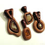 Simple wooden pendants with natural baltic amber