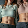 Two teen girls lying on bed 2 (close-up)