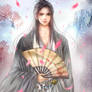 A young man holding a fan