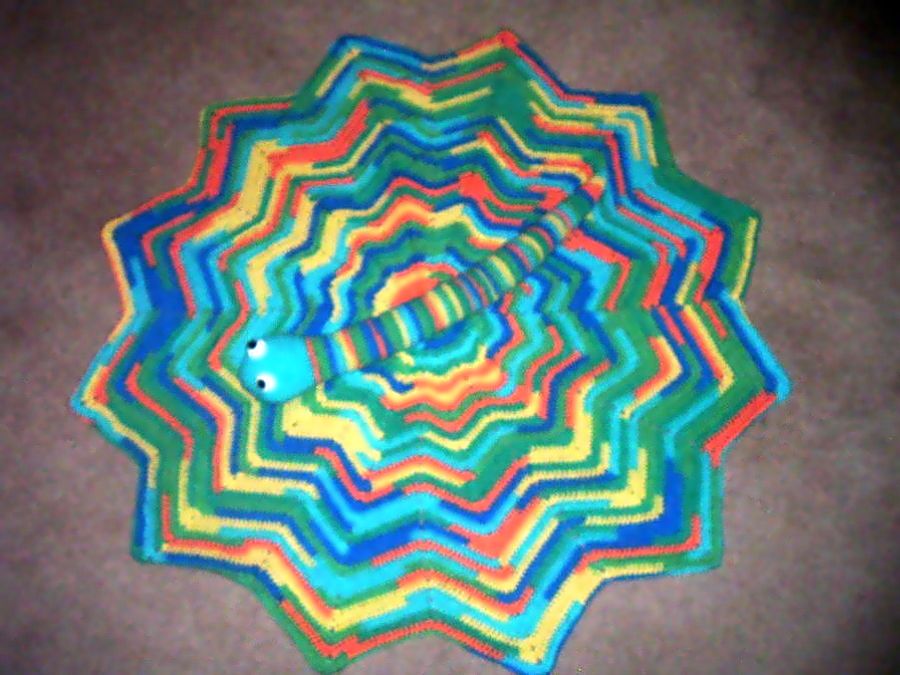 Round ripple afghan and snake toy