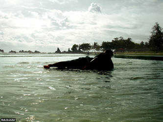 Relaxing at Batu Layar Beach