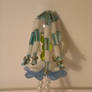 white blue bead doll back vew