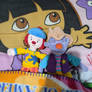 JoJo and Skeebo plush toys laying in my bed