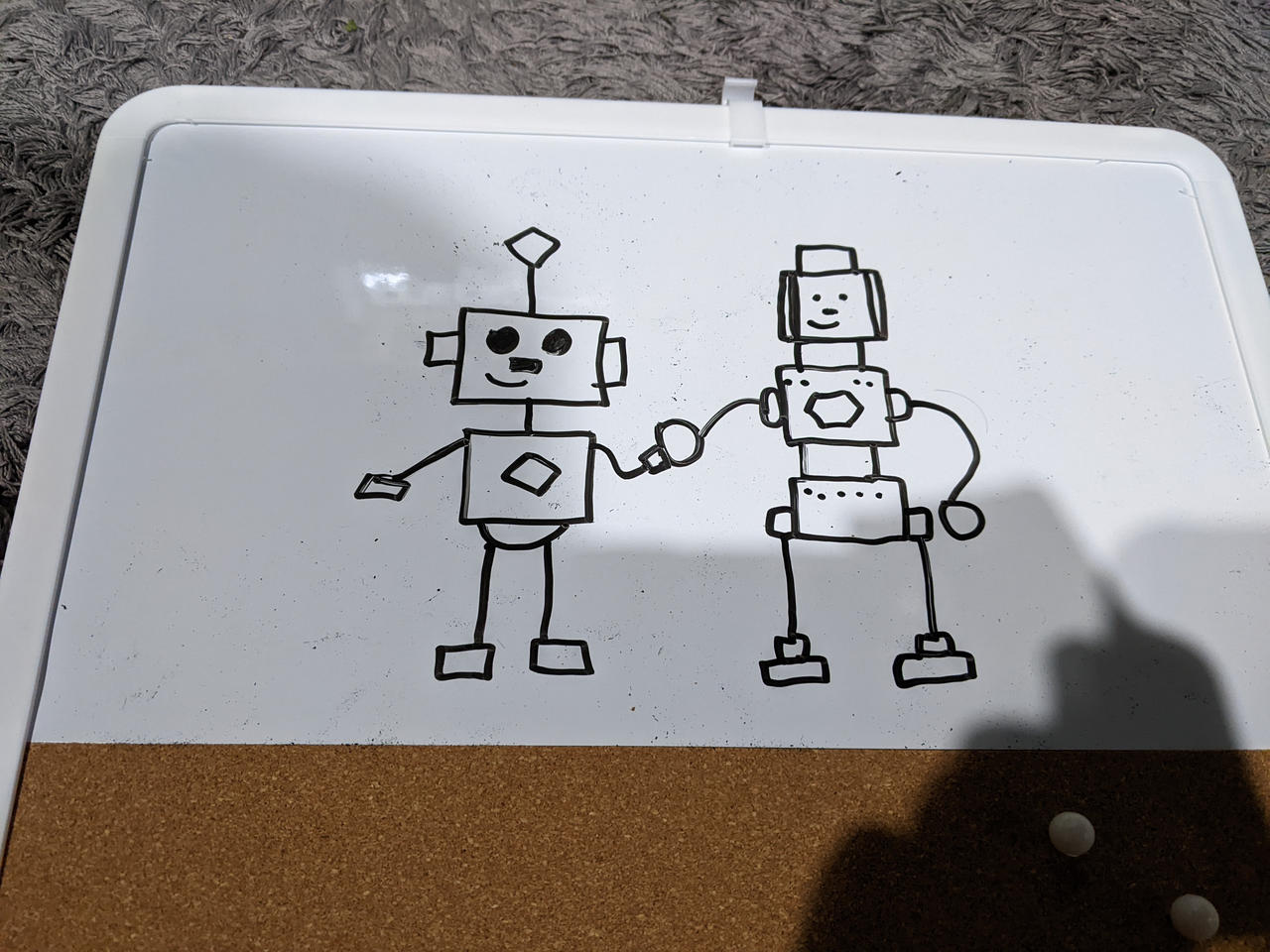 A drawing of Billy and Screwy on a whiteboard