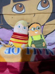 Eubie and Wayne plush toys laying in my bed