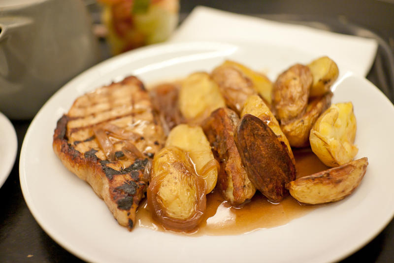 Pan-seared pork loins with baked potatoes