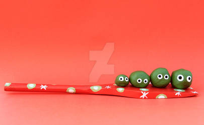 four peas on a spoon