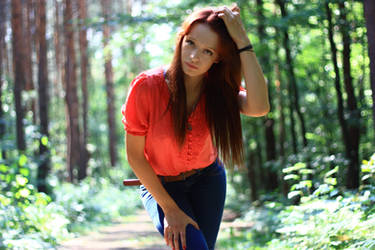 coral blouse and blue jeans