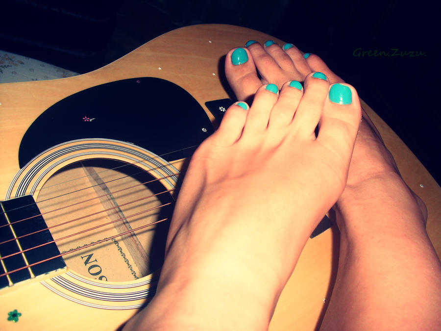 feet and guitar