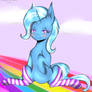 Blue Fluffy Trixie Sitting On Rainbows