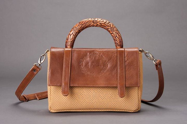 natural skin bag and wooden carved handle