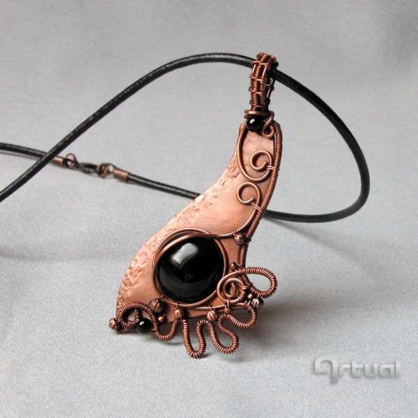 Wire wrapped Black Onyx cabochon on copper sheet