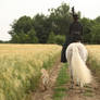 Lady on side saddle and dog back view