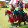two knights red-white and red-green on horses