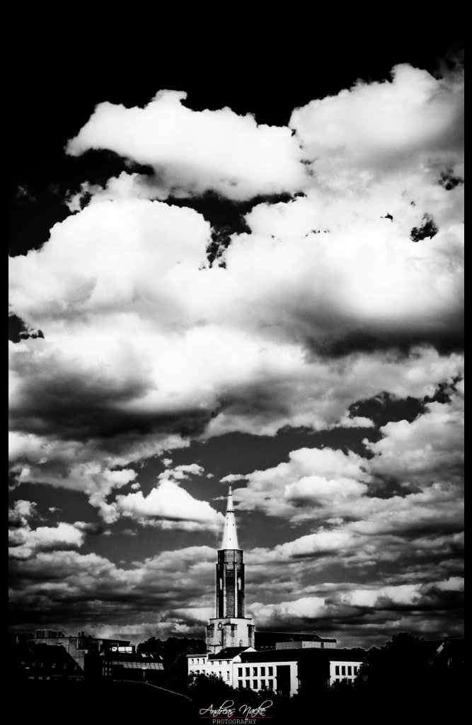 clouds over cross church