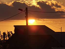 Sunset above house