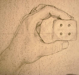 Hand holding a Die