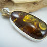 Gold flaked amber pendant