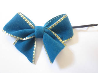 Gold-rimmed blue bow