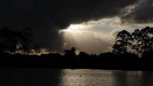 Sun rays through dark clouds