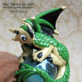 Scaled Green and Tan Polymer Clay Dragon on a Marb