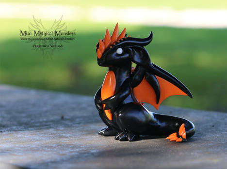 Black and Orange Dragon Sculpture
