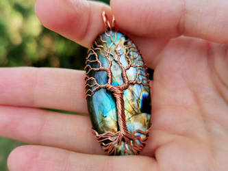 Copper tree pendant.