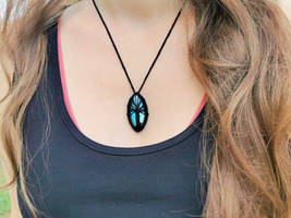 Crochet tree necklace with a labradorite gemstone.