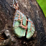 Copper tree pendant with a broke labradorite.