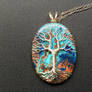 Tree pendant with a shattuckite gemstone.