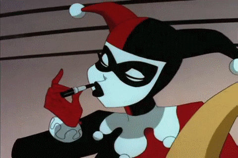 Harley Quinn putting on lipstick