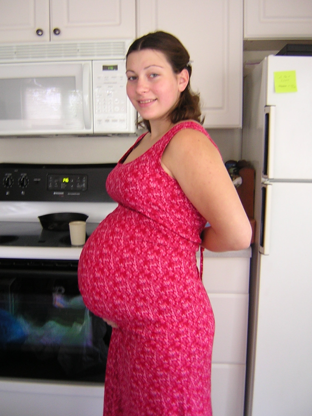 Pregnant Belly In Red Dress