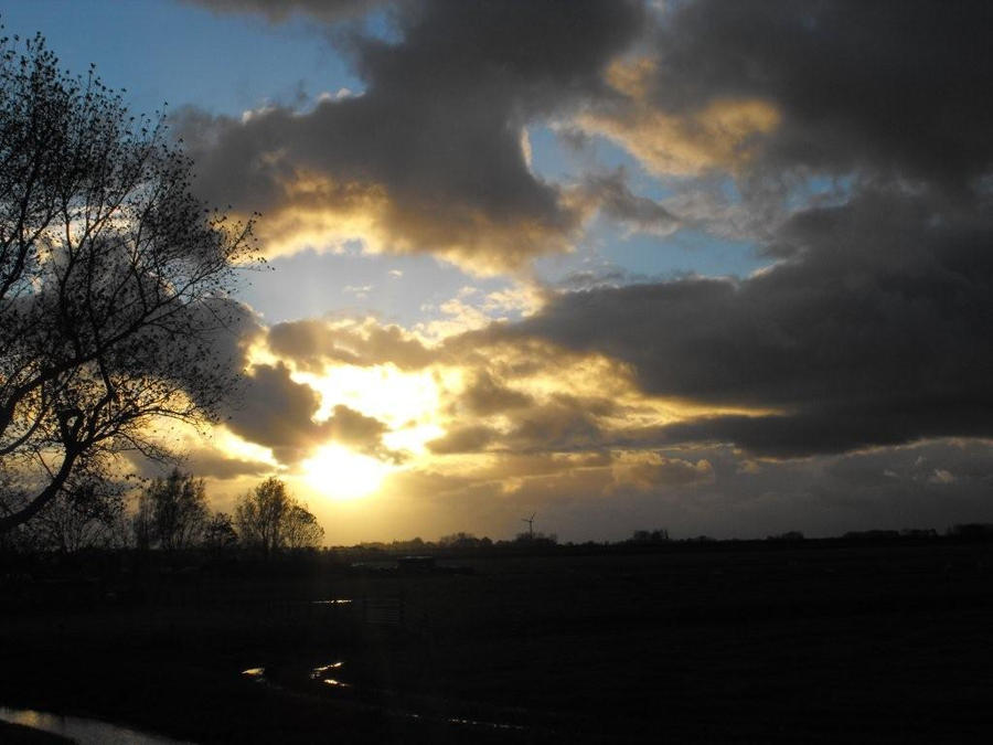 The sun shining trough the clouds.