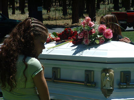 Girl at casket