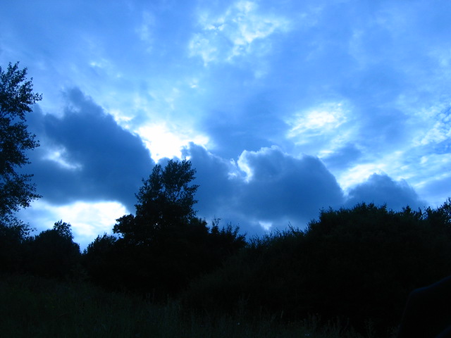 The sun explodes behind clouds