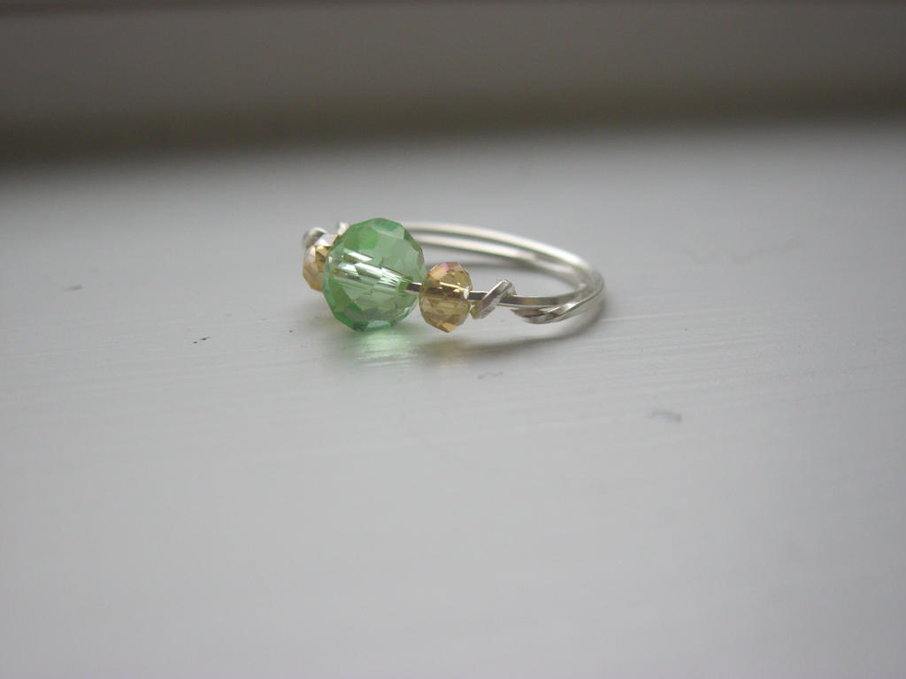 green and champagne ring