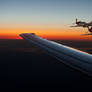 P-51 Mustangs escorting a passenger jet.