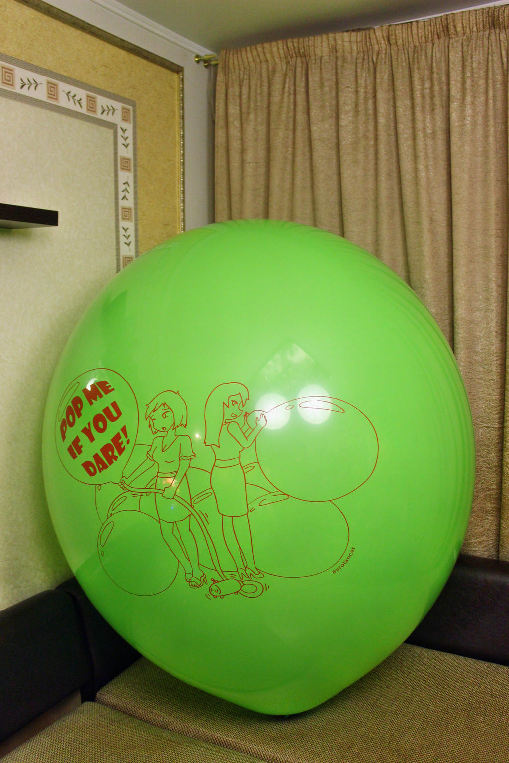 Overinflated green balloon