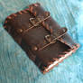 Handmade leather journal with buckles