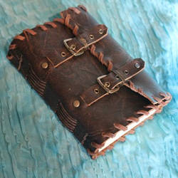 Handmade leather journal with buckles