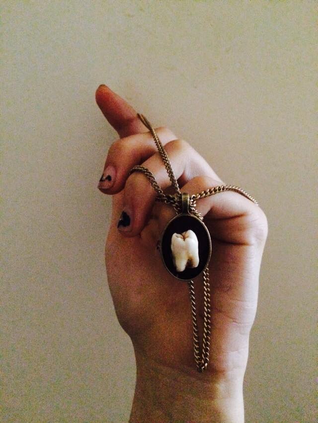 human tooth necklace