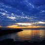 Blue Clouds Over Golden Water