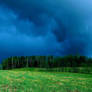 Dark skies, green grass