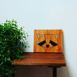 geometric wooden raccoon display