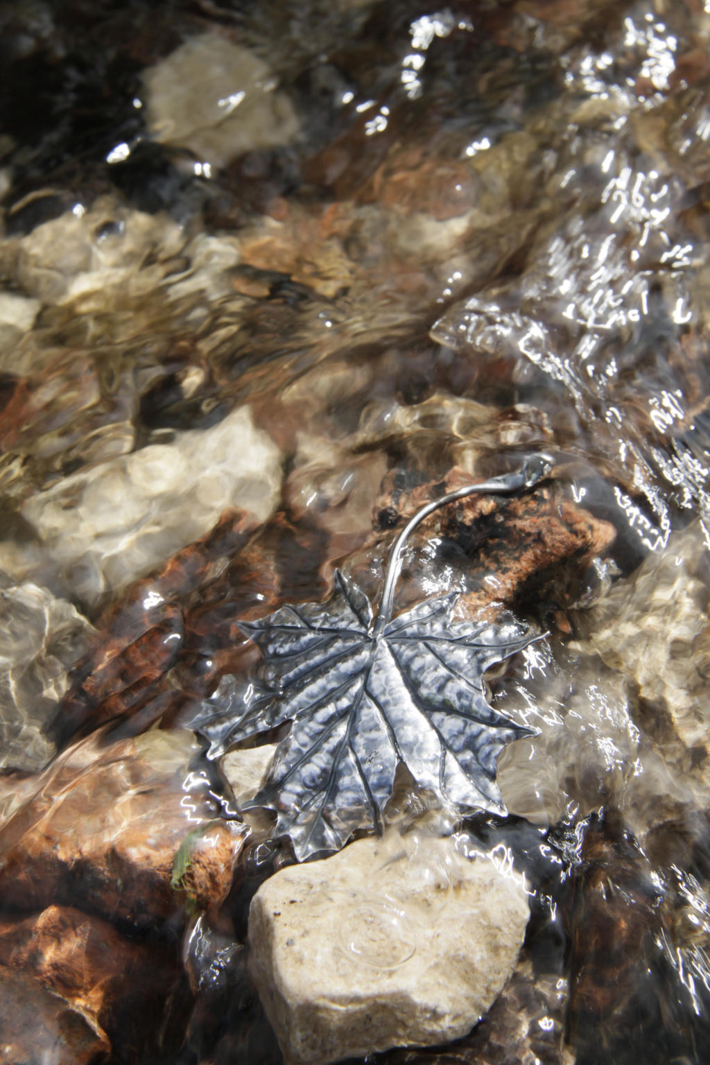 Silver maple leaf brooch with topaz cabochon