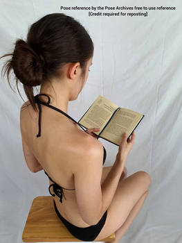 Female High Angle Sitting and Reading Pose