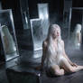 Woman Surrounded by Mirrors