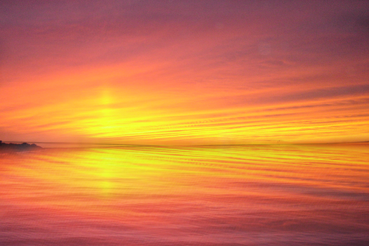 Sunset on reflective sea